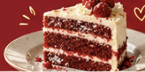 Slice of red velvet cake with cherries